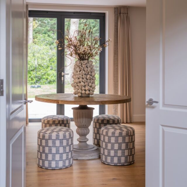 Bespoke upholstered low-level stools sit alongside an eye-catching natural wood table for our private clients family home.#diningroom #diningroomdecor #dinnerparty #diningstyle #homedecor #interiordesign #luxuryhomes #luxuryinteriordesign #texturedwallpaper #bespokefurniture #bespoke #tailormade